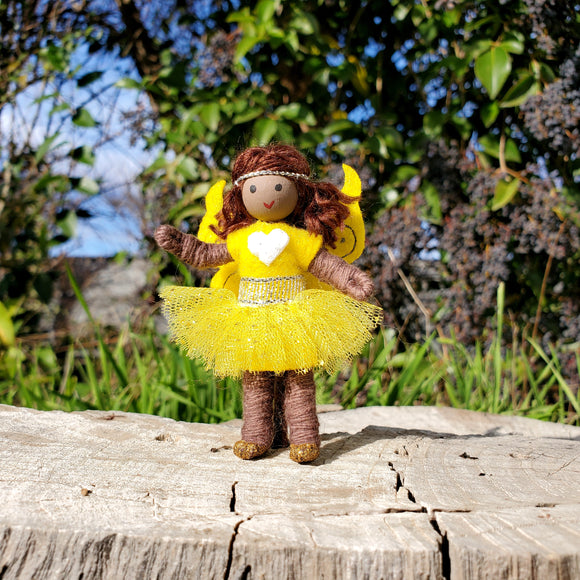 Yellow rainbow fairy doll. Brown skin fairy doll toy