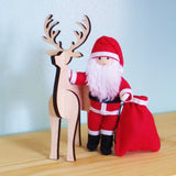 Santa Claus doll with wooden reindeer