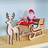 Santa Claus doll with wooden sleigh and reindeer