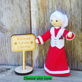 Mrs. Claus with Kindness Elves sign