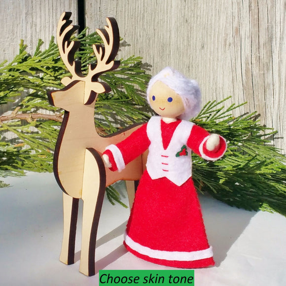 Mrs. Claus with wooden reindeer