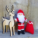 Santa Claus doll with wooden reindeer