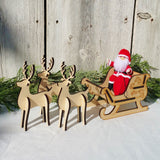Santa Claus doll with wooden sleigh and reindeer