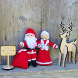 Santa Claus and Mrs Claus doll with wooden reindeer