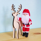 Santa Claus doll with wooden reindeer