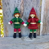 Cute Kindness Elf dolls holding hands. Light brown hair