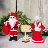 Santa Claus and Mrs. Claus Dolls Kindness Elves sign
