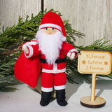 Santa Claus doll with Kindness Elves sign